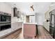 Stylish kitchen equipped with stainless steel appliances, island with seating, and sleek cabinetry at 17546 Westmill Ln, Charlotte, NC 28277