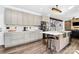 Well-lit kitchen featuring stainless steel appliances, ample cabinetry, and convenient island with seating at 17546 Westmill Ln, Charlotte, NC 28277