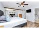 This is a main bedroom featuring wood beams, ceiling fans, and wood floors at 17546 Westmill Ln, Charlotte, NC 28277