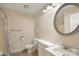 This is a small, brightly lit bathroom with a toilet, vanity and mirror and a shower/tub with a curtain at 1773 Hunters Trl, Rock Hill, SC 29732