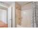 A view of a shower/tub in a bathroom, with a shower curtain, wall-mounted shower head and assistance bar at 1773 Hunters Trl, Rock Hill, SC 29732