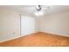 This bedroom has a ceiling fan, closet and sliding glass doors to access the balcony at 1773 Hunters Trl, Rock Hill, SC 29732