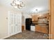 Traditional kitchen featuring wood cabinets, tile backsplash, laminate countertops and black appliances at 1773 Hunters Trl, Rock Hill, SC 29732