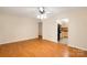 This living room features a ceiling fan, wood floors and a doorway that leads into the kitchen at 1773 Hunters Trl, Rock Hill, SC 29732