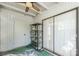 A small sunroom-like room featuring an external door, sliding glass doors, shelving and white siding at 1773 Hunters Trl, Rock Hill, SC 29732
