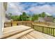 Large wooden back deck overlooking the backyard and wooded area at 225 Carrie Ct, Concord, NC 28027