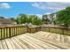 A spacious wooden back deck overlooks the backyard, perfect for outdoor entertaining and relaxation at 225 Carrie Ct, Concord, NC 28027