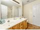 Bathroom featuring a double sink vanity, large mirror, and walk-in shower at 225 Carrie Ct, Concord, NC 28027