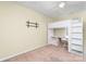 Bedroom featuring a loft bed with a built-in desk and ceiling fan at 225 Carrie Ct, Concord, NC 28027