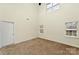Neutral bedroom featuring plush carpet, two windows, and a ceiling fan for added comfort at 225 Carrie Ct, Concord, NC 28027