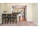 View of the eat-in bar looking into the kitchen with stainless appliances and dark countertops at 225 Carrie Ct, Concord, NC 28027