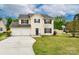 Charming two-story home with a two-car garage, well-maintained lawn, and a classic design at 225 Carrie Ct, Concord, NC 28027