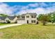 Traditional two-story house with a manicured front lawn, attached two car garage and black shutters at 225 Carrie Ct, Concord, NC 28027