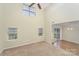 Spacious living room with vaulted ceilings, multiple windows, and access to a dining area at 225 Carrie Ct, Concord, NC 28027