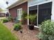 Landscaped backyard with decorative rock, plantings, and brick home exterior at 227 Crystal Springs Ln, Shelby, NC 28150