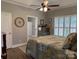 Spacious bedroom featuring a cozy bed, wood floors, and natural light from the window at 227 Crystal Springs Ln, Shelby, NC 28150