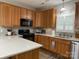 Bright kitchen features stainless steel appliances, light wood cabinets, and a white countertop island at 227 Crystal Springs Ln, Shelby, NC 28150
