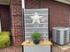 Outdoor decor with star decoration, green plant, and decorative animal statues on a bench at 227 Crystal Springs Ln, Shelby, NC 28150