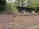 Sturdy brick retaining wall with plantings on top, adding visual interest and functionality at 227 Crystal Springs Ln, Shelby, NC 28150
