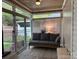 Cozy sunroom with lots of natural light, outdoor views and comfortable seating at 227 Crystal Springs Ln, Shelby, NC 28150