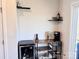 Elegant bar nook featuring a wine fridge, coffee maker, and stylish shelving near a bright window at 2315 Doby Creek Ln # 77, Charlotte, NC 28262