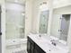 Bathroom featuring a walk-in shower and double sink vanity at 2315 Doby Creek Ln # 77, Charlotte, NC 28262