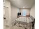 Bright bedroom featuring a window for natural light, neutral walls, and a comfortable bed with drawers at 2315 Doby Creek Ln # 77, Charlotte, NC 28262