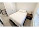 Cozy bedroom featuring neutral walls, carpet flooring, and a comfortable bed with side table and lamp at 2315 Doby Creek Ln # 77, Charlotte, NC 28262