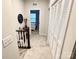 Upstairs hallway featuring modern decor, closet, and a view of the bedroom at 2315 Doby Creek Ln # 77, Charlotte, NC 28262