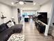 Open concept living room, kitchen, and dining room with hardwood floors and modern appliances at 2315 Doby Creek Ln # 77, Charlotte, NC 28262