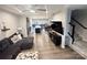 Bright, open living area with hardwood floors, flowing into dining and kitchen area with plenty of natural light at 2315 Doby Creek Ln # 77, Charlotte, NC 28262