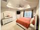 Bright main bedroom showcasing a decorative tray ceiling, ceiling fan, and large window at 2315 Doby Creek Ln # 77, Charlotte, NC 28262
