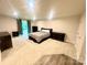 Spacious main bedroom with neutral walls, carpet, dark wood furniture and door to private yard at 2315 Doby Creek Ln # 77, Charlotte, NC 28262