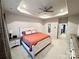 Main bedroom features a tray ceiling, fan, and neutral paint at 2315 Doby Creek Ln # 77, Charlotte, NC 28262