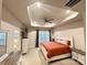 Main bedroom with a tray ceiling, fan, and ensuite bathroom at 2315 Doby Creek Ln # 77, Charlotte, NC 28262