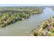 Panoramic aerial shot of a lakeside property with private docks, lush greenery, and serene waters at 234 Winding Shore Rd, Troutman, NC 28166