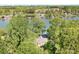 A lakefront home is nestled among lush greenery, offering serene waterfront living and access at 234 Winding Shore Rd, Troutman, NC 28166