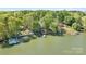A scenic aerial view captures the home's lakefront location and private dock at 234 Winding Shore Rd, Troutman, NC 28166