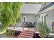 Outdoor dining area with wood staircase, wood railings, and shingle siding at 234 Winding Shore Rd, Troutman, NC 28166