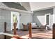 Back patio with patio furniture, wood railings, and gray shingle siding at 234 Winding Shore Rd, Troutman, NC 28166