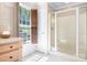 Bright bathroom featuring a glass-enclosed shower and custom vanity at 234 Winding Shore Rd, Troutman, NC 28166