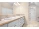 Bathroom with double vanity and tile countertop and a closet in the background at 234 Winding Shore Rd, Troutman, NC 28166