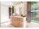 Charming bathroom with custom vanity, natural light, and elegant fixtures at 234 Winding Shore Rd, Troutman, NC 28166