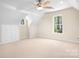 Versatile bonus room with built-in storage and natural light at 234 Winding Shore Rd, Troutman, NC 28166