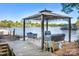 A dock and gazebo with comfortable seating offer serene views and lake access at 234 Winding Shore Rd, Troutman, NC 28166