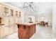 View of the kitchen featuring an island and lots of cabinetry, with an adjacent dining area at 234 Winding Shore Rd, Troutman, NC 28166