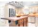 Bright kitchen with an island, stainless steel appliances, and tile backsplash at 234 Winding Shore Rd, Troutman, NC 28166