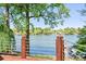 Wide lake view from a back deck with metal railing with trees at 234 Winding Shore Rd, Troutman, NC 28166