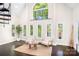 Bright and airy living room with expansive windows and lake views at 234 Winding Shore Rd, Troutman, NC 28166