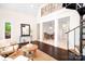 Spacious living room with spiral staircase and open view to the dining area at 234 Winding Shore Rd, Troutman, NC 28166